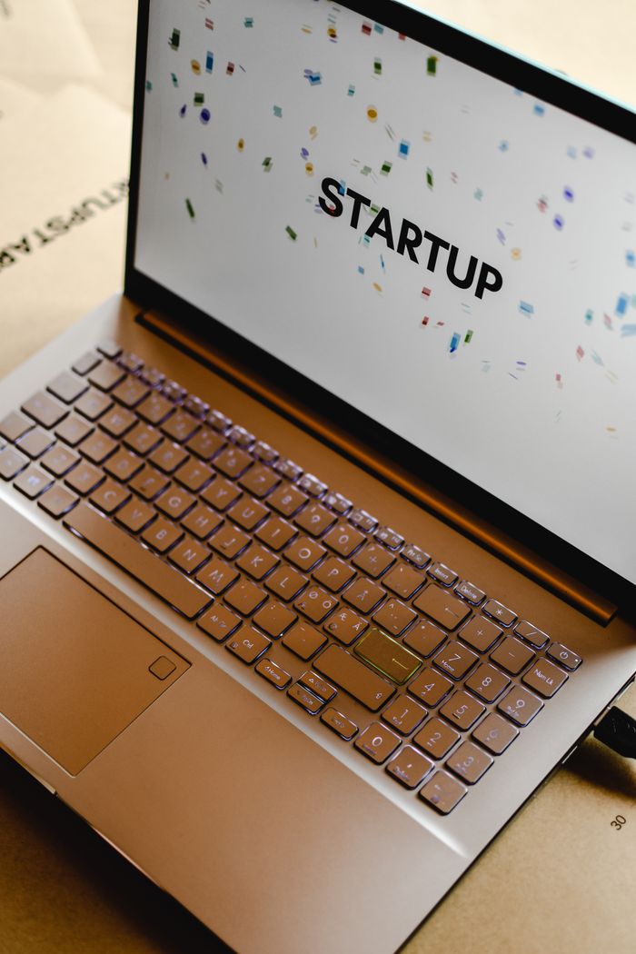 Home Close-up of a laptop screen displaying the word "STARTUP", ideal for business and tech themes.